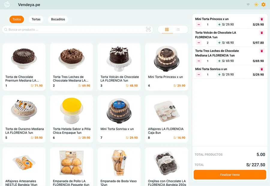 La misma pastelería en modo claro, con tortas, alfajores y empanadas y cinco productos en el carrito